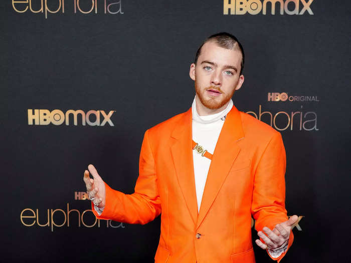 Her "Euphoria" costar Angus Cloud also attended the premiere in this bright-orange suit and white turtleneck.