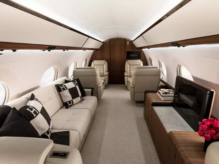 The jet has four living areas. The main cabin comprises of 10 seats and a sofa.