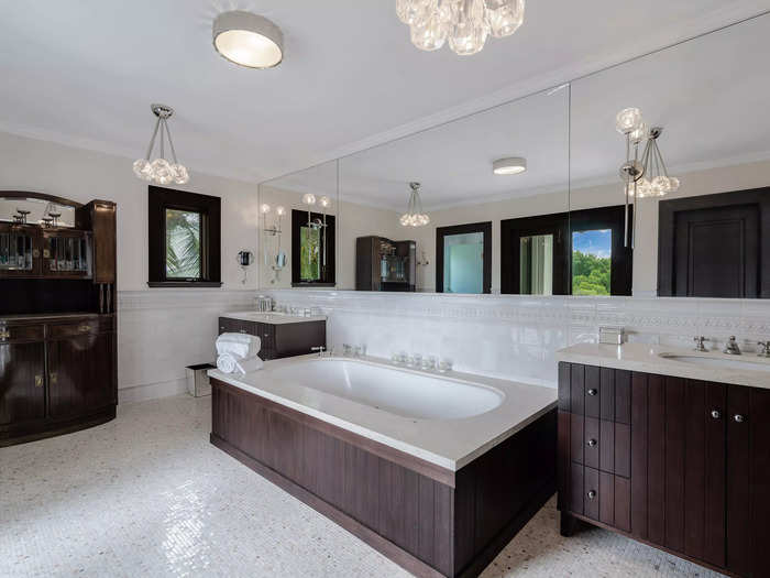 The master bathroom features wood and marble finishings. It also has a double vanity and a rain shower, Bluntzer said.