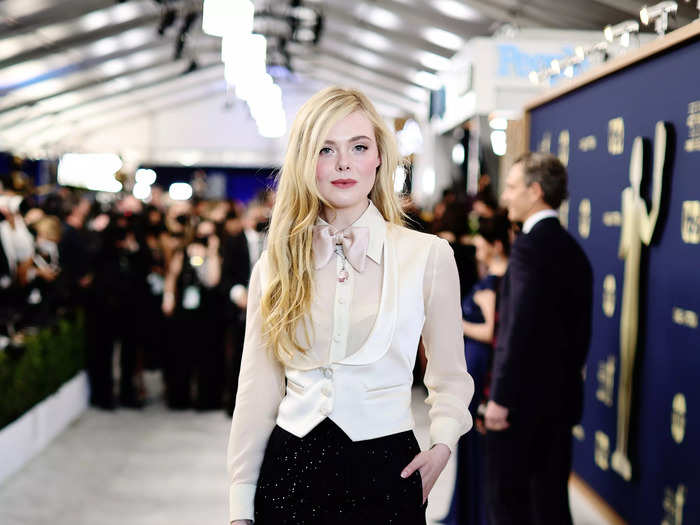 Elle Fanning prompted others to "wear the pants" in this feminine tuxedo-like ensemble.