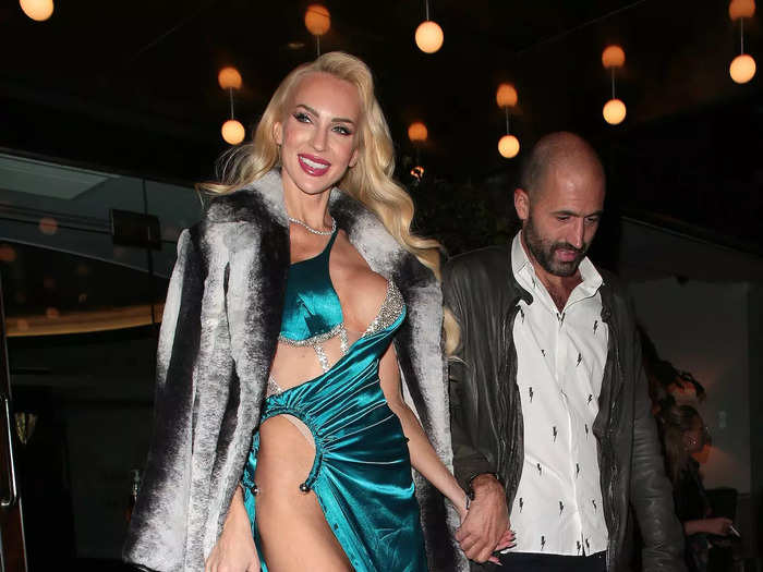 She looked even more daring a few days later. For a party celebrating her makeup collection with Ciaté, Quinn wore a turquoise dress with chest cutouts, a hip-high slit, and a short train.