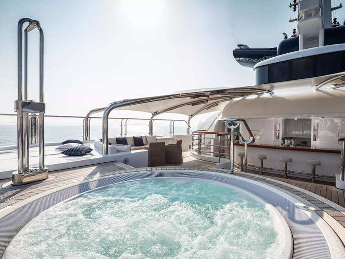 The ship can accommodate 12 people, but the pool and jacuzzi are surrounded by enough outdoor seating for a large party, a bar, and an extensive dining table ...