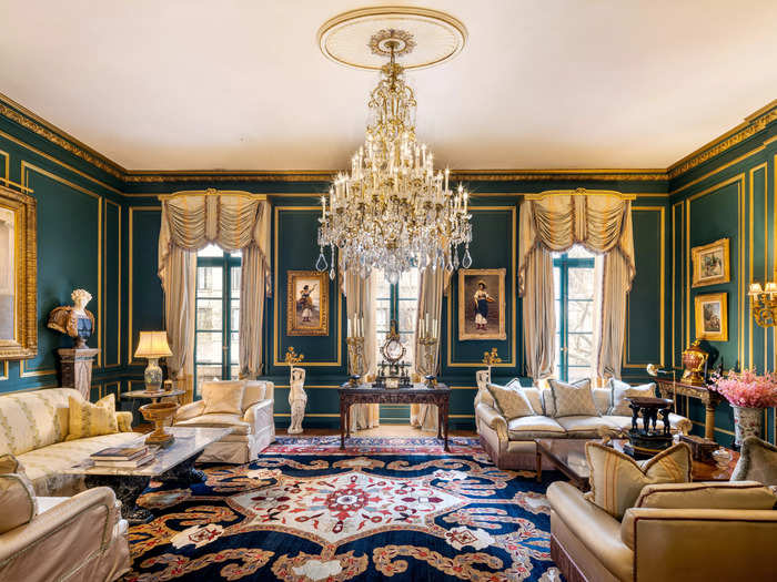 The jade-green grand living room, also on the second floor, oozes old money with a 12-foot ceiling.