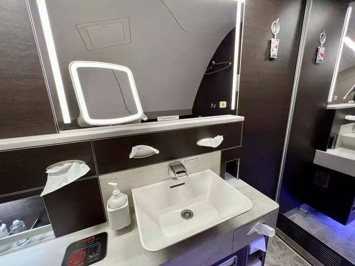 One lavatory is smaller than the other, but both are at least triple the size of a standard aircraft bathroom and feature sit-down vanity tables, marble-style countertops, baby-changing stations, and full-size mirrors.