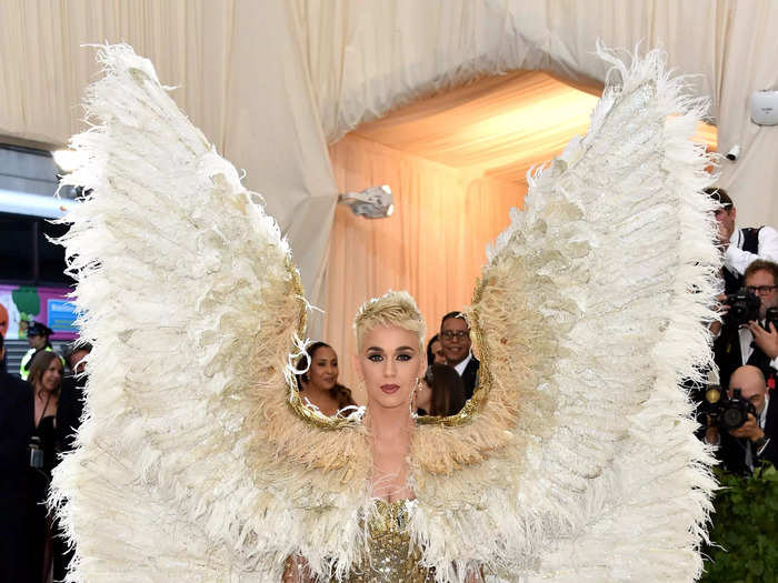 Perry dazzled in giant angel wings for a glimmering gold minidress for "Heavenly Bodies" in 2018.