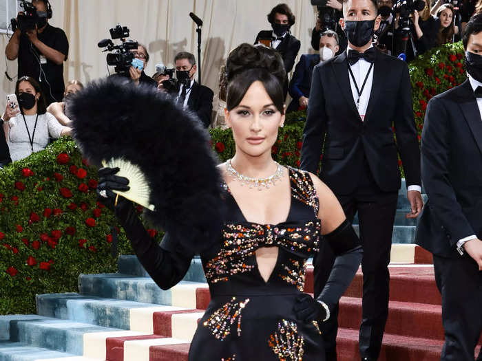 Kacey Musgraves looked chic in a black gown with colorful rhinestones.