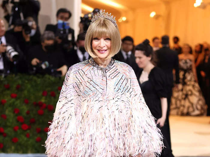 Anna Wintour chose a colorful frock with a poncho-style top.