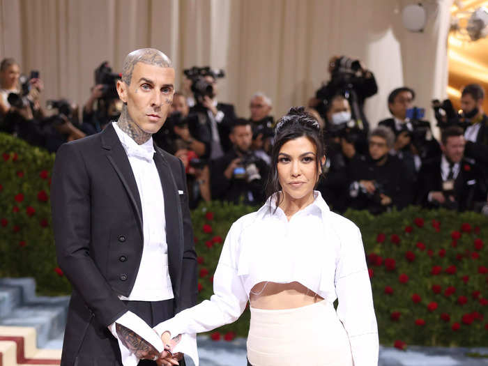 Kourtney Kardashian coordinated with her fiancé Travis Barker in matching black-and-white outfits.