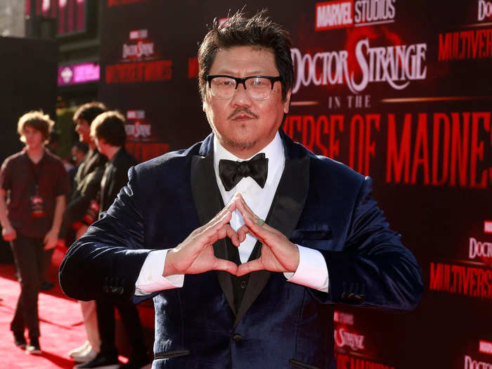 Benedict Wong looked far more dressed up than his character Wong, in a navy and black suit.