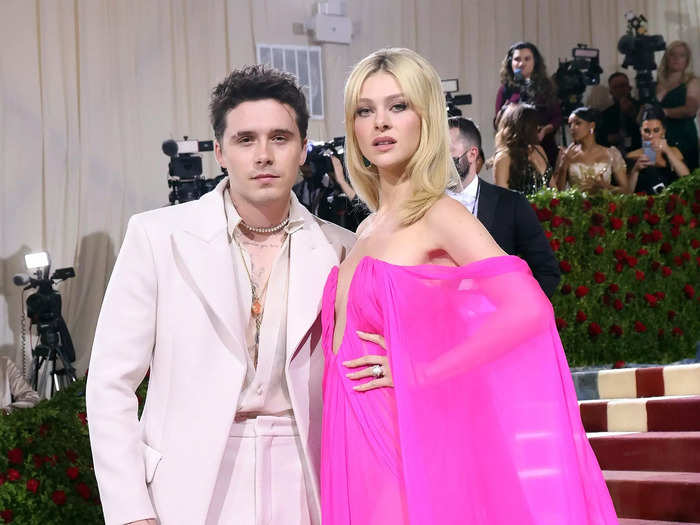 Brooklyn and Nicola Peltz Beckham arrived in complementary ensembles from Valentino.