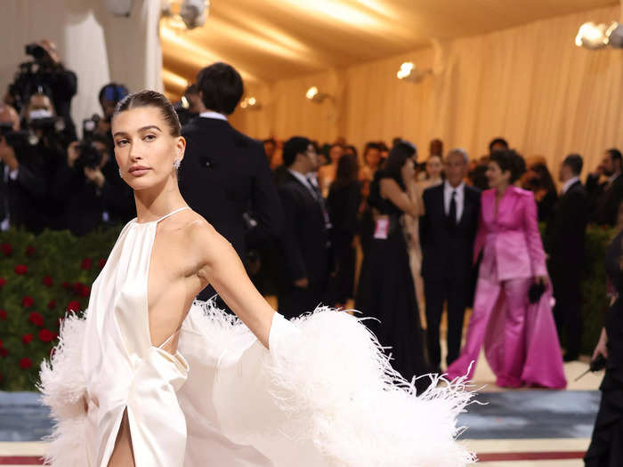 Hailey Bieber wore a stunning white gown and feather coat inspired by Jerry Hall