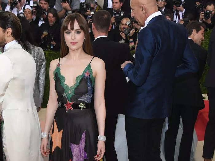 She stepped it up in 2016 with a black, sleeveless Gucci gown that had green lace across its neckline and a bold, colorful star print down its skirt.