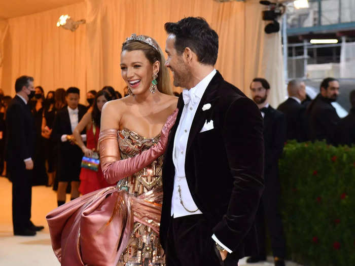 Ryan Reynolds grinned at Blake Lively as they posed for photos at the Met Gala.