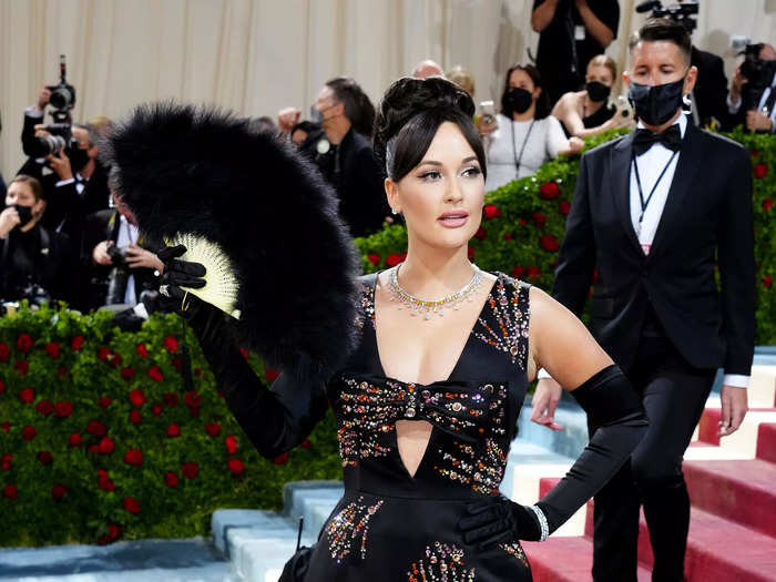 Kacey Musgraves was on-theme in a black gown with streaks of colorful crystals.