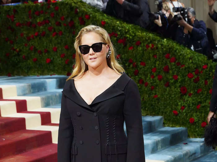 Amy Schumer went for a tuxedo dress on the red carpet.