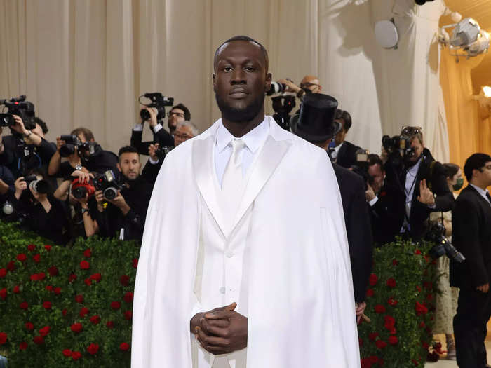 British rapper Stormzy said it was "nice to shine today" in his bright-white look.