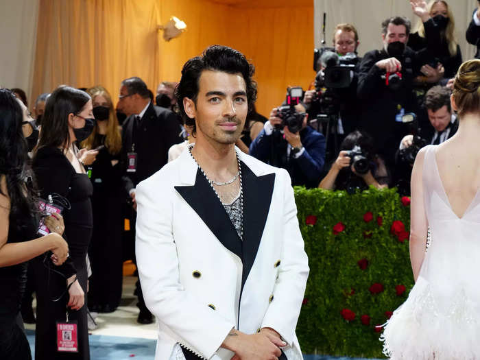 Joe Jonas attended in previously worn womenswear from Louis Vuitton.