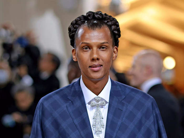Belgian singer-songwriter Stromae looked regal in a cropped cape with a bold print.
