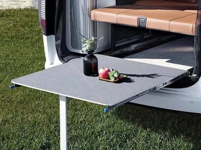 … and an additional sliding table that extends out the rear of the van. This outdoor table is available on the Camper 11 model as well.