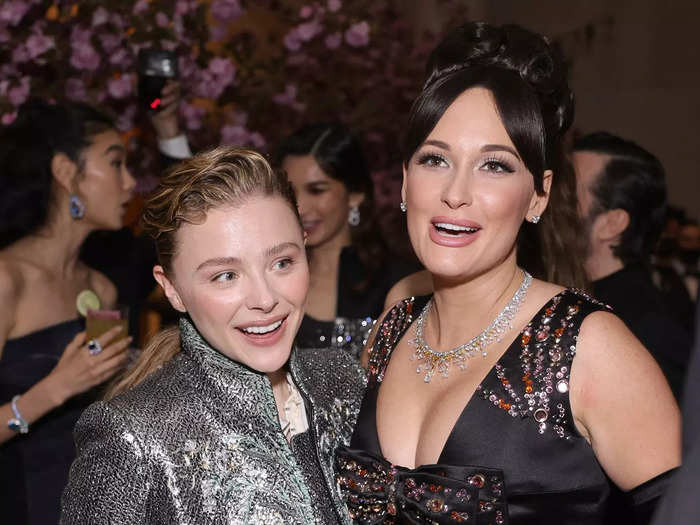 Chloë Grace Moretz and Kacey Musgraves embraced while enjoying the night