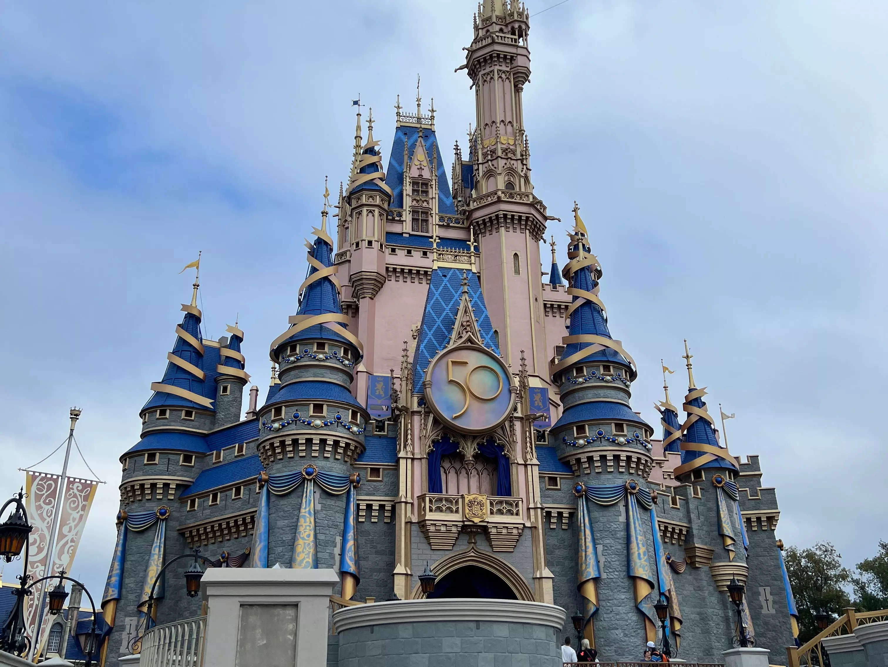 cinderella castle decorated for the 50th anniversary celebration at disney world