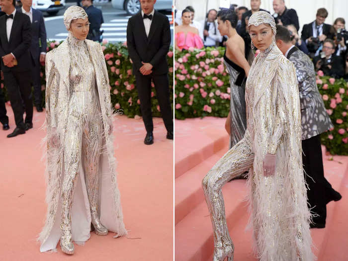 For the 2019 Met Gala, the model went with a jumpsuit, floor-length coat, and a head covering.