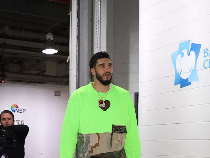 Boston Celtics player Jayson Tatum went wild with a neon green and camo top and mismatched sneakers.