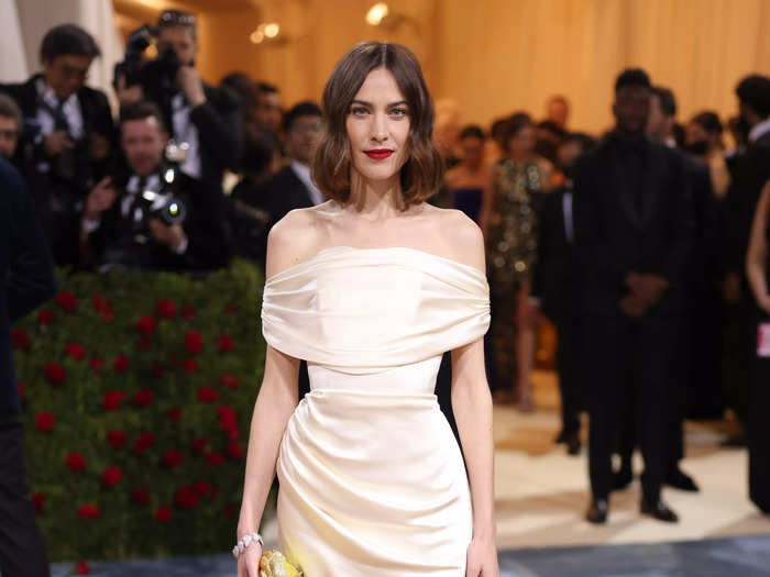 Alexa Chung wore an ivory Christian Siriano gown for her 10th Met Gala appearance.