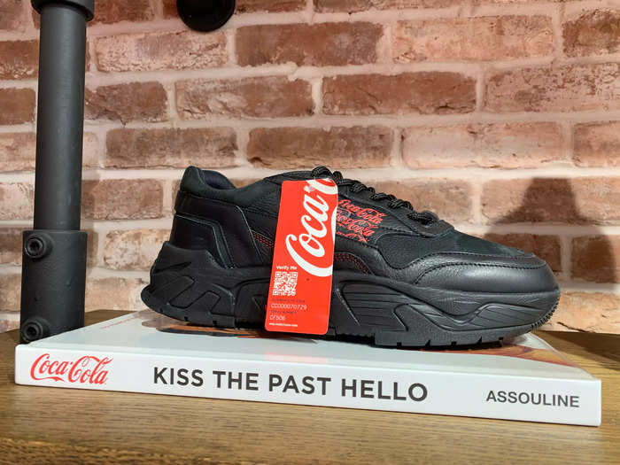 This pair of Coca-Cola themed trainers costs £195 ($241), one store worker told Insider ...