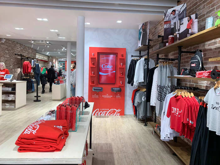 The store is home to a range of Coca-Cola branded merchandise, including clothing, collectibles, shoes, and a bar selling variations on the famous soda.