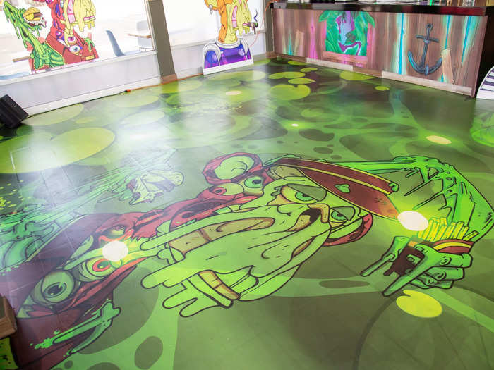 … and the bright green floor proudly flashing more ape imagery.