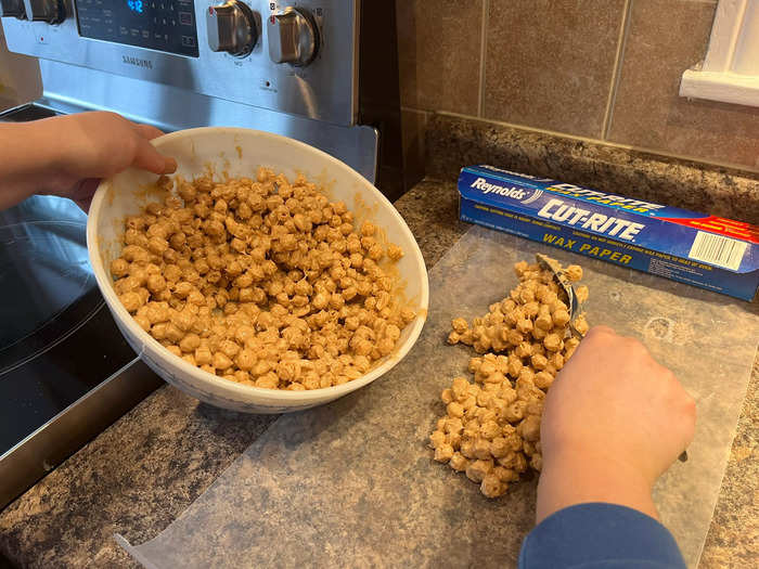 After all the ingredients were combined, I began to layout the coated cereal on wax paper.