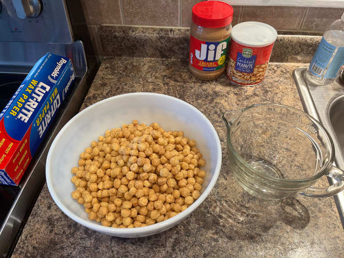 Using a large measuring cup, I added eight cups of the cereal to a large mixing bowl.