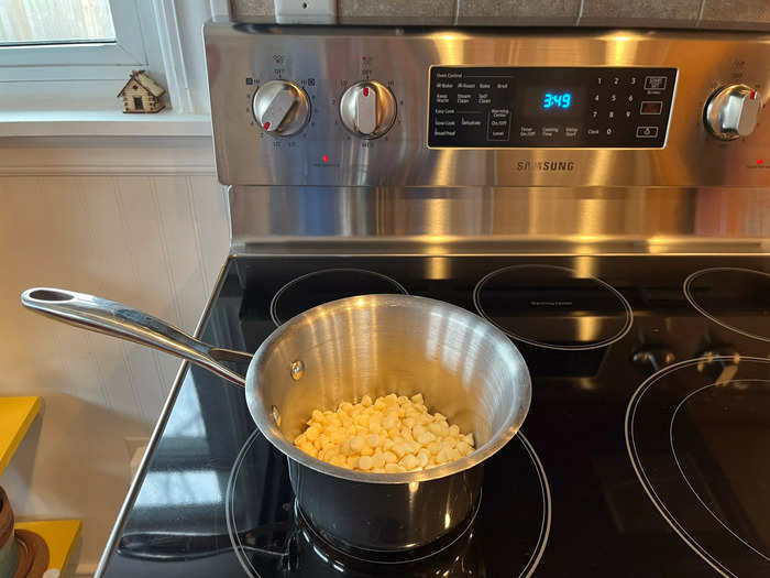 I started by adding the white chocolate chips to a medium saucepan and melted it on low heat.