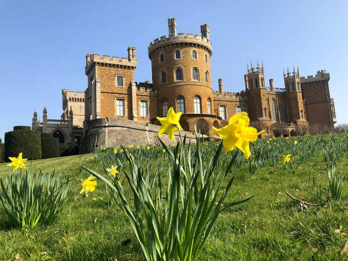 The initial view of the building with its towers and turrets framed by yellow daffodils was dramatic.