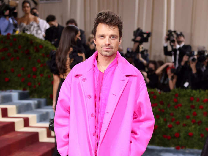 Sebastian Stan arrived at the 2022 Met Gala in a pink bomber jacket, shirt, and pants.