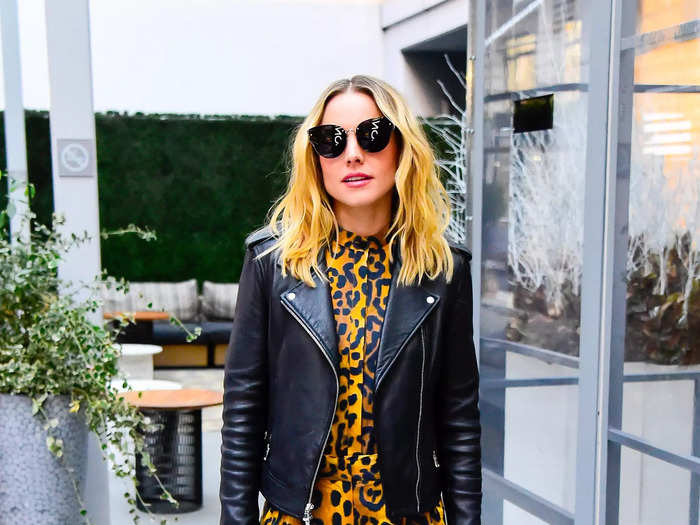 Bell looked cool in a bold leopard-print jumpsuit and leather jacket.