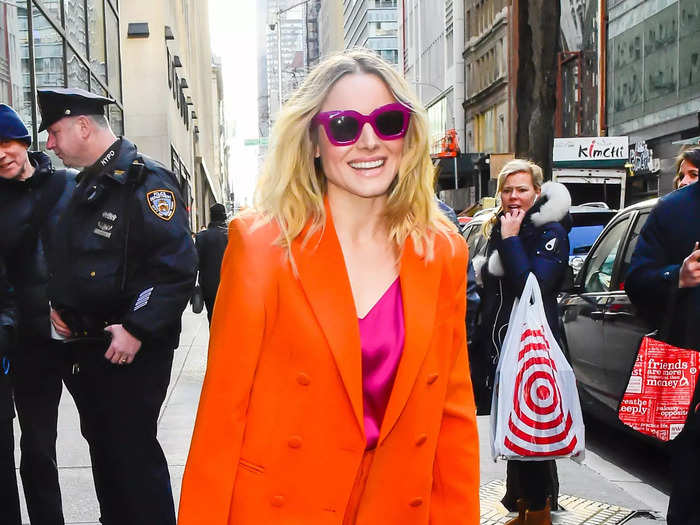 Kristen Bell stunned in a bright orange suit with colorful accents outside of the Today Show in 2019.