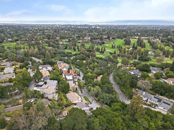 The home is located in the prestigious Country Club neighborhood of Los Altos Hills.