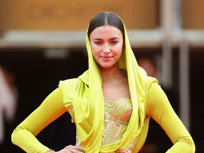 Irina Shayk wore a chartreuse dress with fabric draping over her head to the festival in 2014.