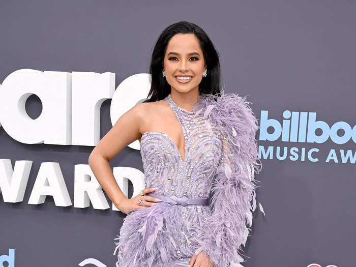 Becky G wore a purple asymmetrical minidress with feathers and beads.