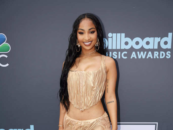 Shenseea wore a champagne-colored ruched crop top and skirt.