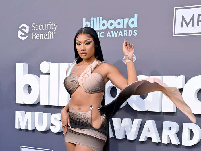 Megan Thee Stallion wore a two-tone bra top and a micro skirt to the awards show.