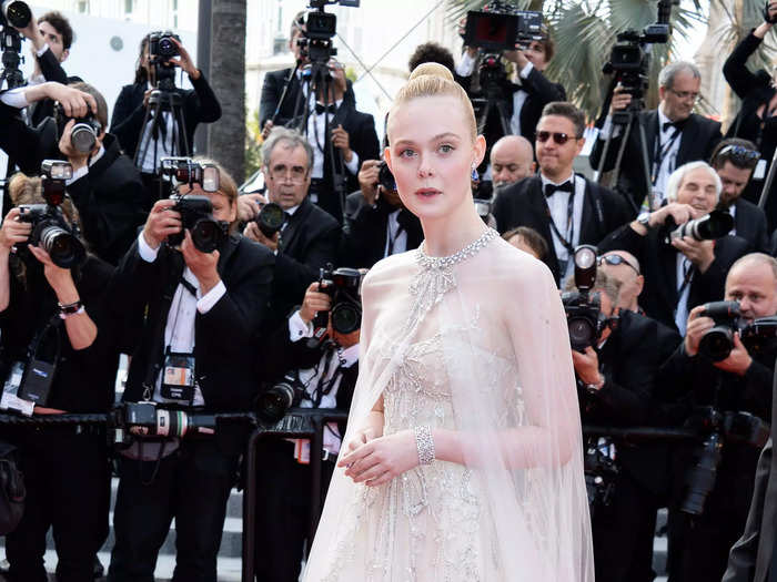 Elle Fanning looked ethereal at the 2019 Cannes Film Festival in a tulle gown with a crystal-embellished sheer cape.