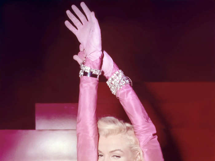 Monroe also wore a bright pink strapless silk gown with a giant bow on the back and matching tall gloves in "Gentlemen Prefer Blondes."
