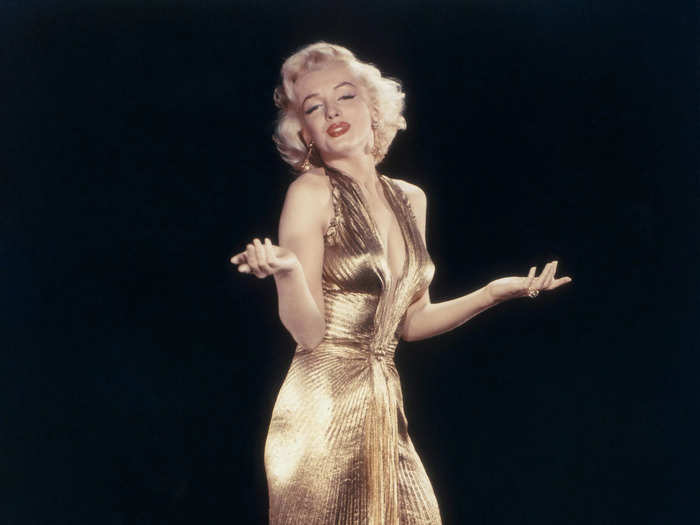 While performing a scene in "Gentlemen Prefer Blondes," Monroe wore a plunging gold lamè halterneck gown with a low back and pleating.