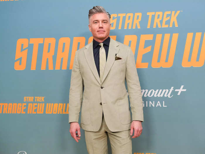 Since Christopher Pike is a human, actor Anson Mount looks exactly like his character minus the yellow uniform.