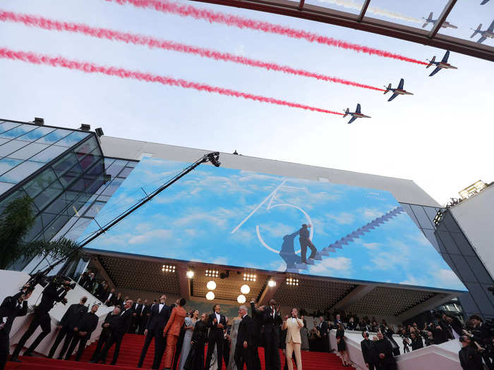 In grand Cannes fashion, the red-carpet arrivals ended with an airshow. Before the cast walked in, they saw the French elite acrobatic flying unit, Patrouille de France, soar overhead.