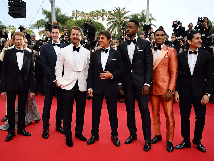 "Top Gun" franchise producer Jerry Bruckheimer and "Top Gun: Maverick" director Joseph Kosinski stand on the carpet with their cast.