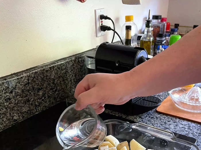 Pour about half a cup of water over the potatoes.